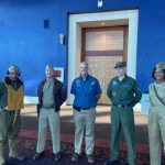 Dave Shultz with Living History volunteers in uniform.