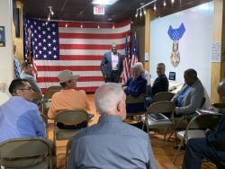 Airman Heritage Foundation President, Al Herring, welcomes guests and speaks to the room about the mission of the Foundation.