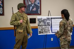 TSgt. Geer represents the WWII Infantryman, posing with the all-black 761st Tank Battalion.