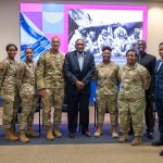 Maj. Gen. (ret.) Al Flowers posing with other panelists and attendees.