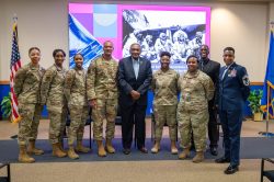 Maj. Gen. (ret.) Al Flowers posing with other panelists and attendees.